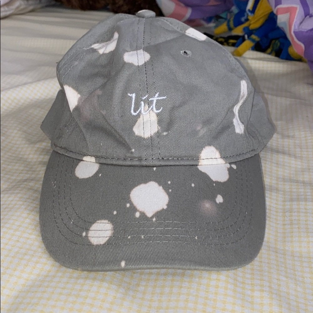 Gray “Lit” adjustable strapback cap.